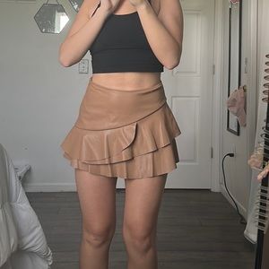 worn only for picture. Latte (tan) colored ruffle vegan leather skort.